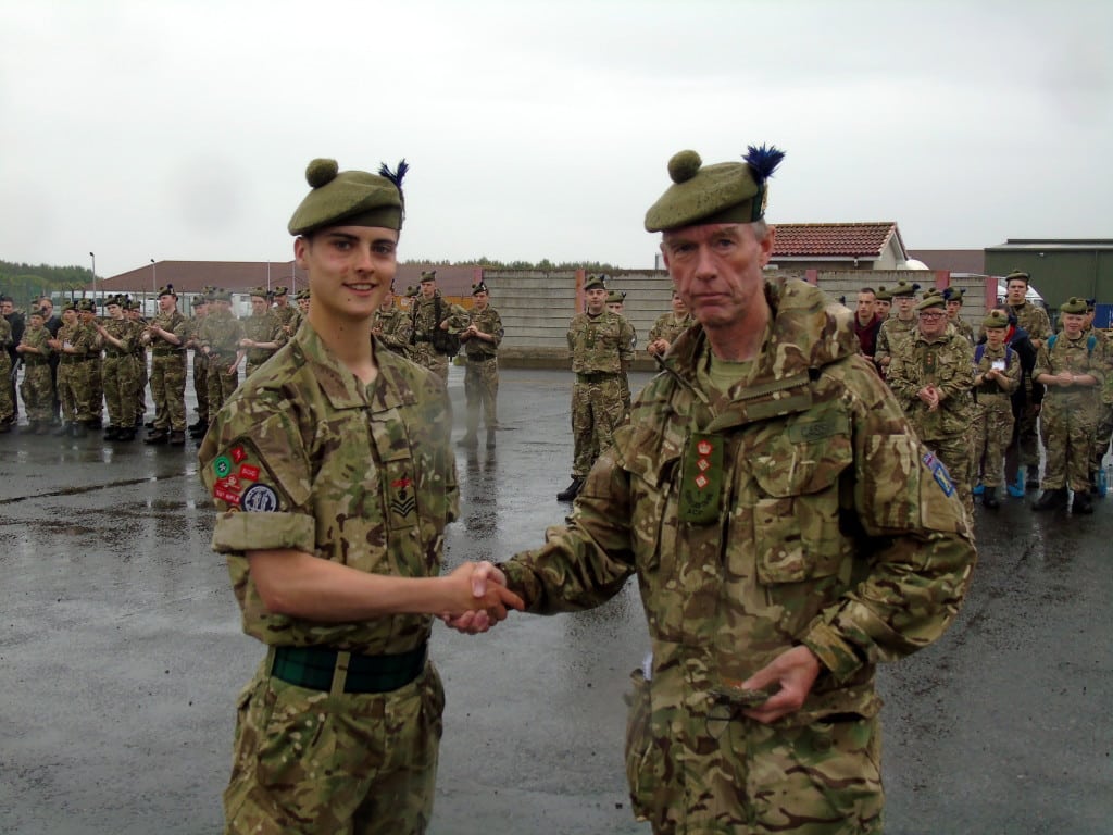 CSgt Cameron receiving his Cadet 100 badge from Battalion Commandant Colonel Iain Cassidy