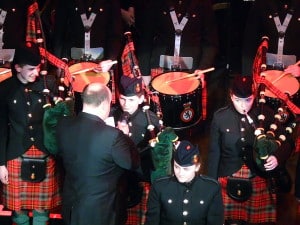 Cadet Tom Spencer (1 Highlanders) being interviewed by show compere WO1 Adrian Beckett MBE, Senior Band Sergeant Major of the Household Division.