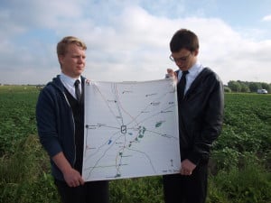 Cpl Michael Neilson (left) with Cdt George Humphreys (right) with a map of the Langemarck battle site