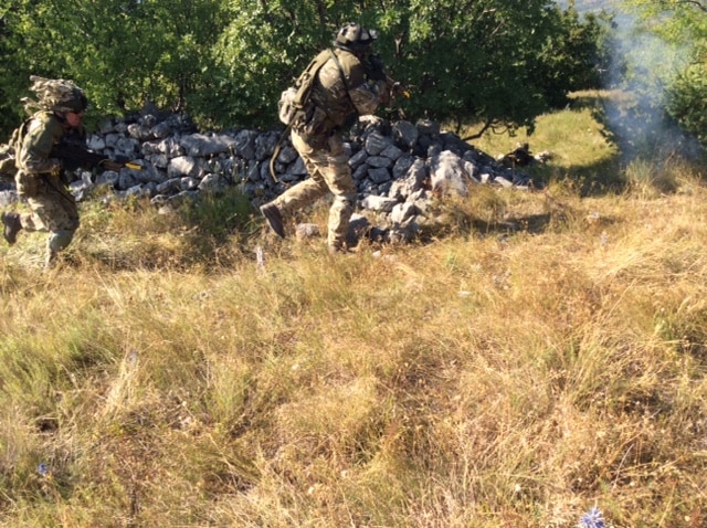 7 SCOTS soldiers attack an 'enemy' position.