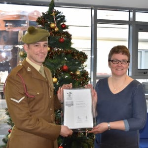 LCpl Trevor Stewart-East and Head Teacher Laura Smith with the Silver Award.