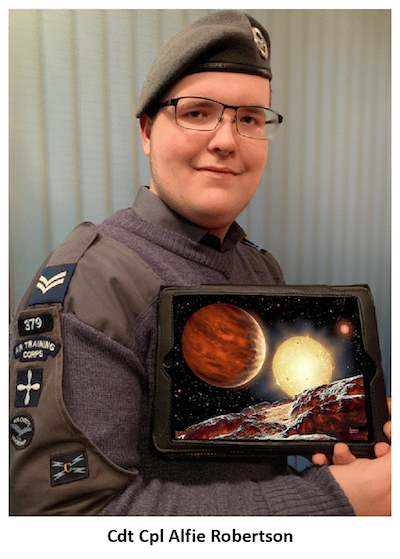 Alfie Robertson holding image of planets