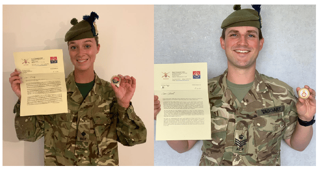 Adult volunteers holding Commanders Coins and letters