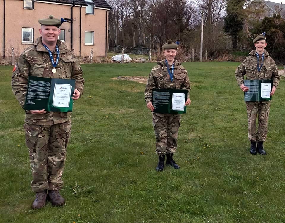 Adult instructor and cadets with Guinness certificates.