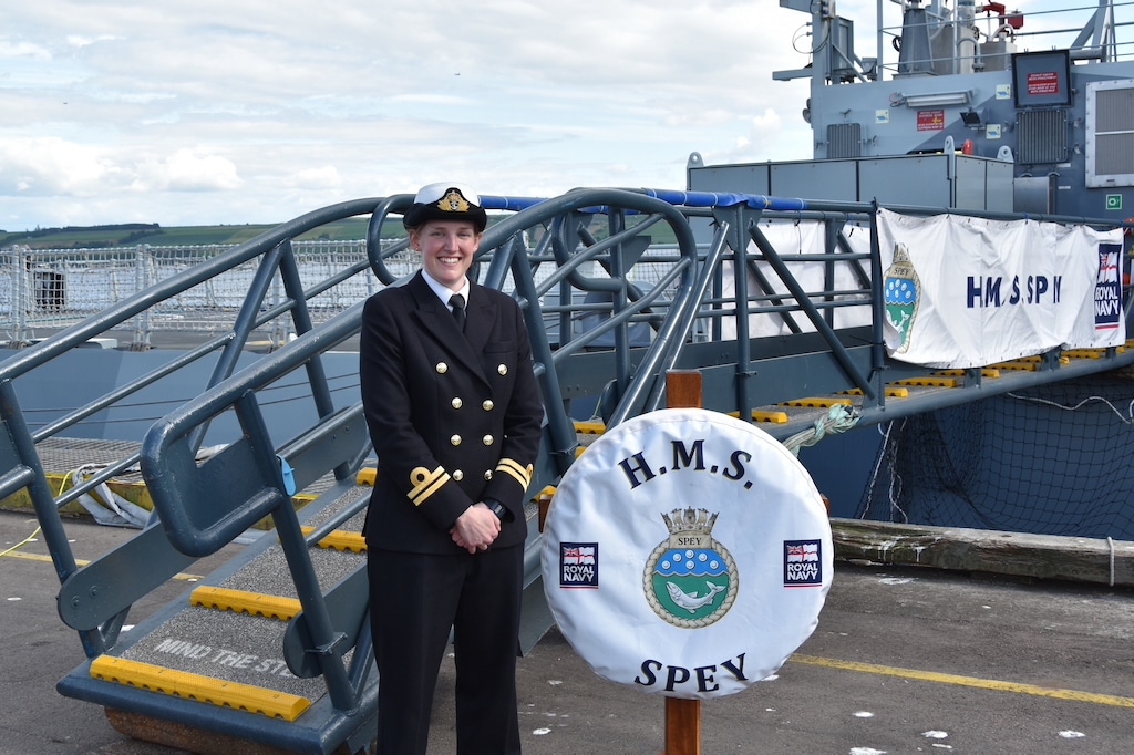 Lt Gibbons in front of HMS Spey on the ship's commissioning day. 