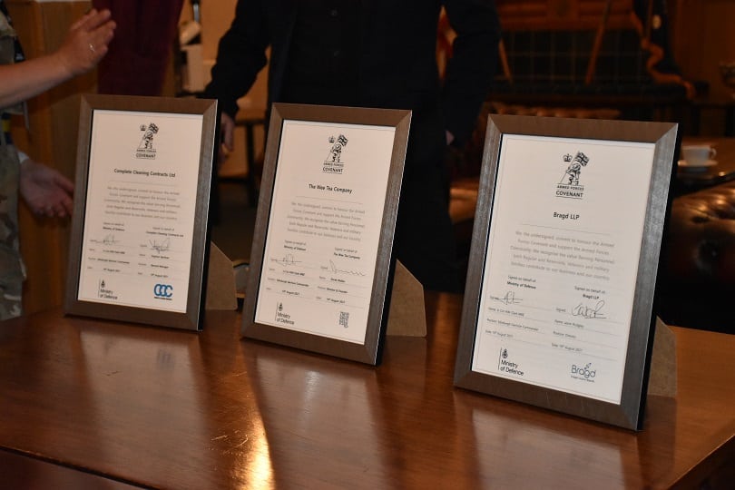 Award certificates in frames on table