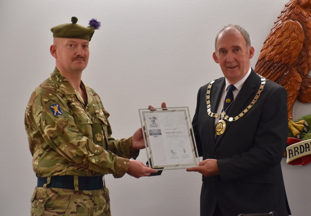 WO2 Colin Smith from C Company of 7 SCOTS presented the Silver Award to Norman MacDonald, Convener of The Highland Council.