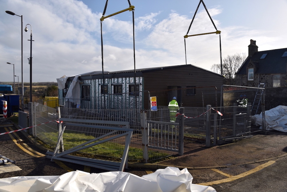 The last section is slowly lowered into position.