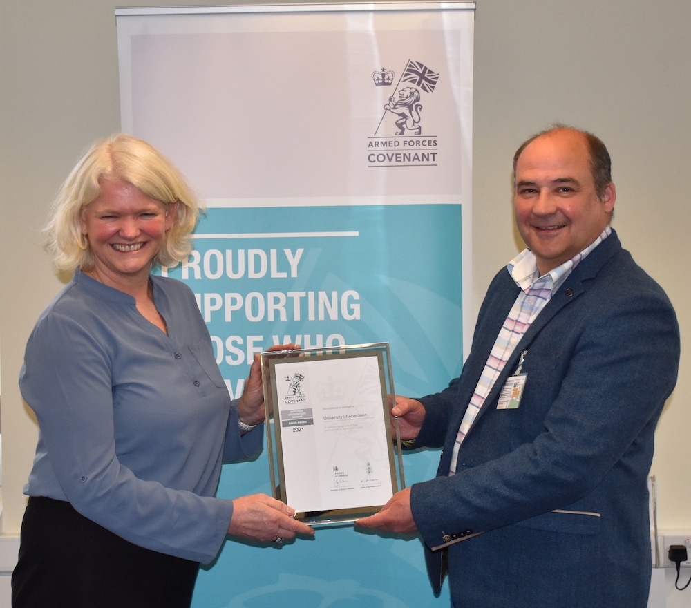 Aberdeen University Armed Forces Champion Abbe Brown receives the ERS Silver Award from HRFCA's Ray Watt.