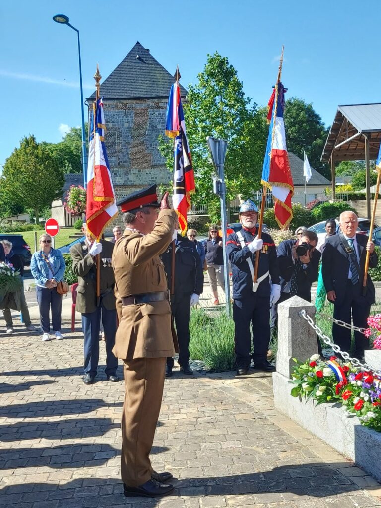 Brigadier Wrench paying his respects at the St Valery war memorial.