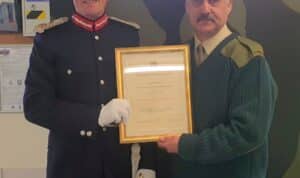 SMI Mills (right) receiving his Lord Lieutenant's Certificate from Mr George Asher, Lord Lieutenant for Nairnshire.