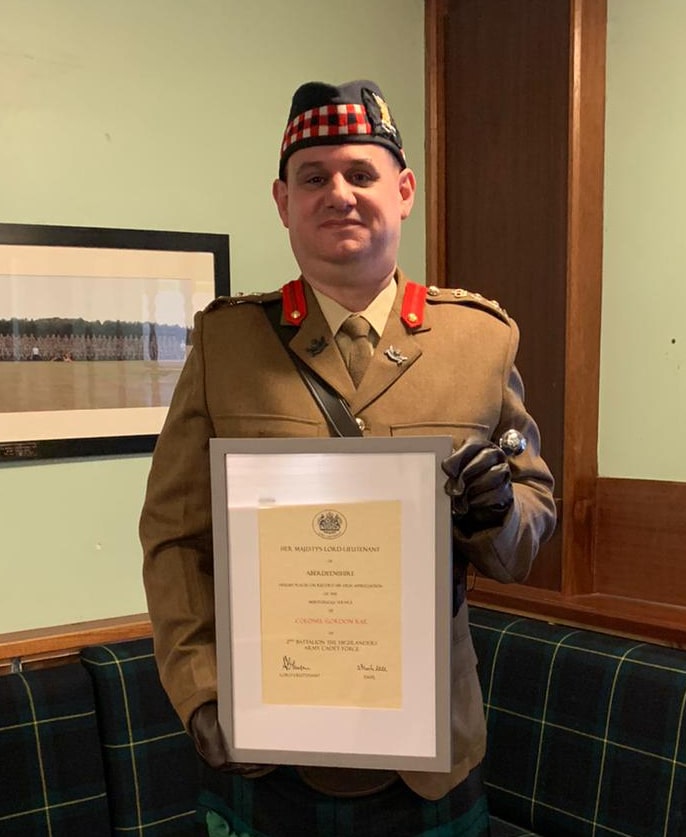 Colonel Gordon Rae with his certificate.