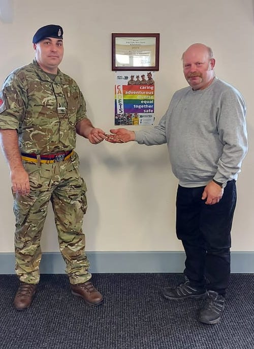 SMI Mackie hands over the keys to the detachment.