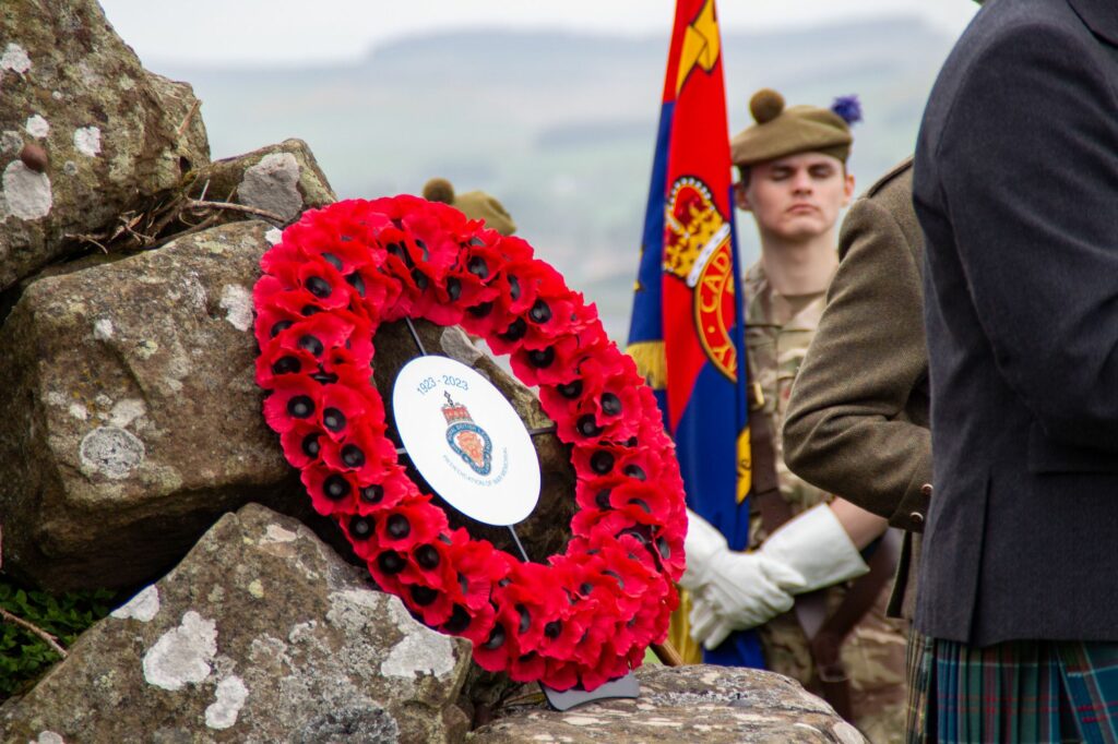 Poppy wreath on war memorial.
