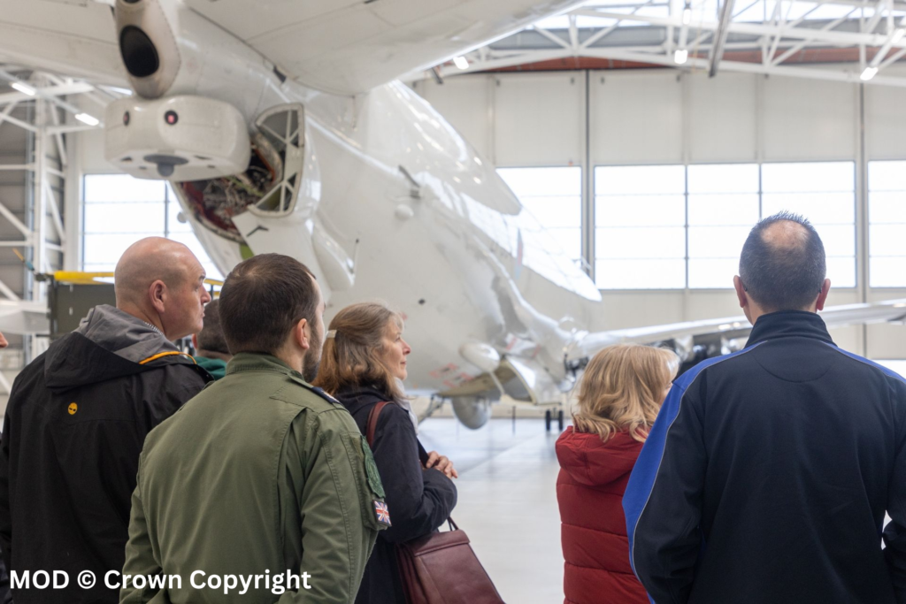 Employers next to aircraft