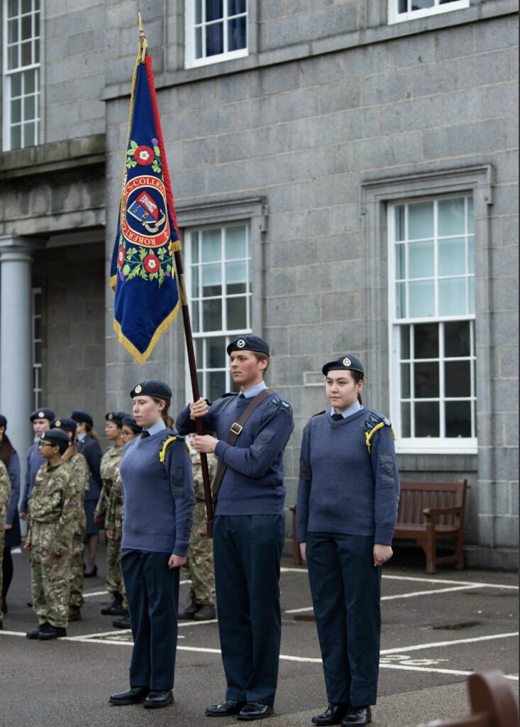 Three cadets with flag