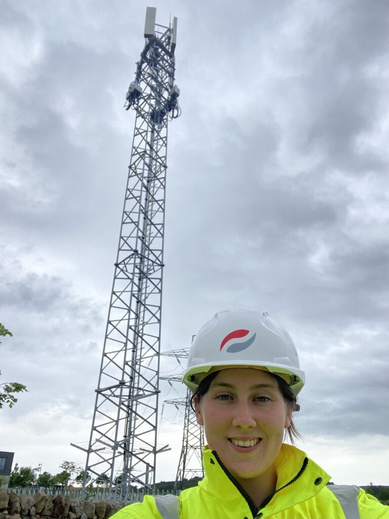 Reservist beside telecommunications mast.