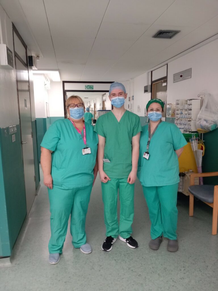 ACF student with two members of hospital staff.