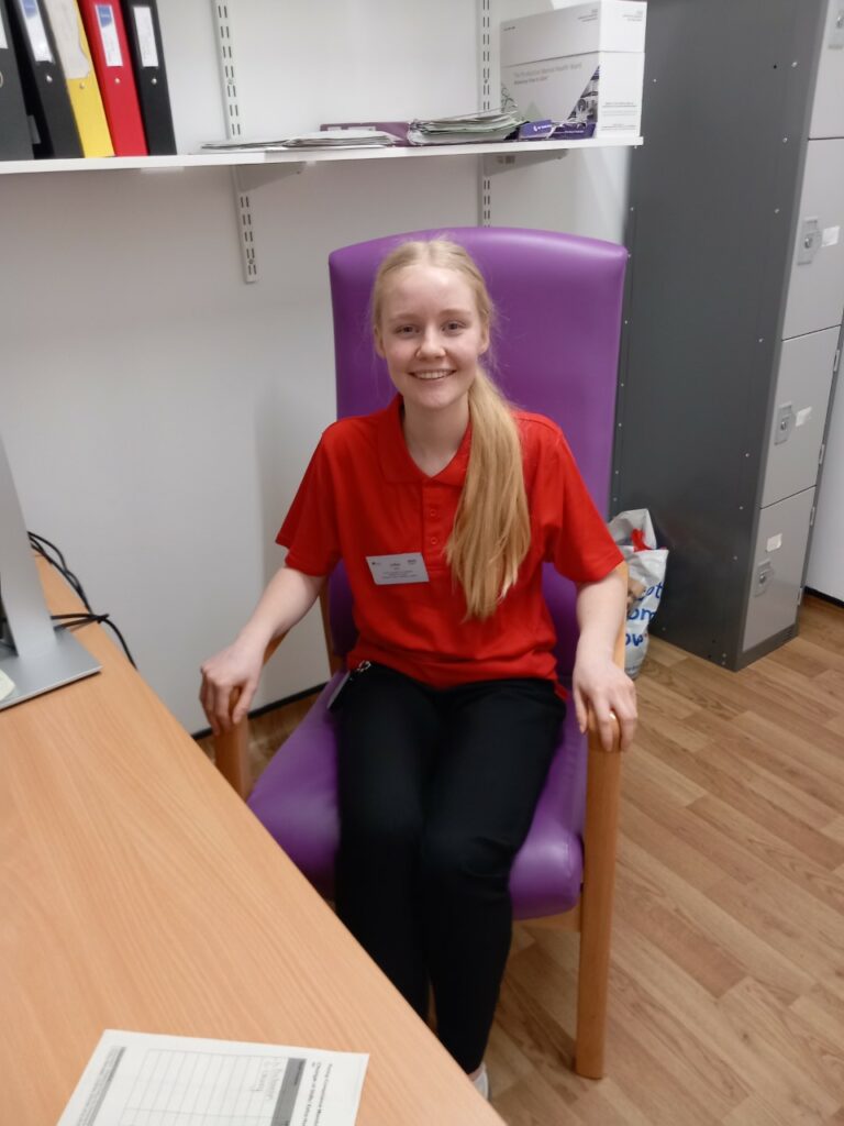 ACF student in a chair.