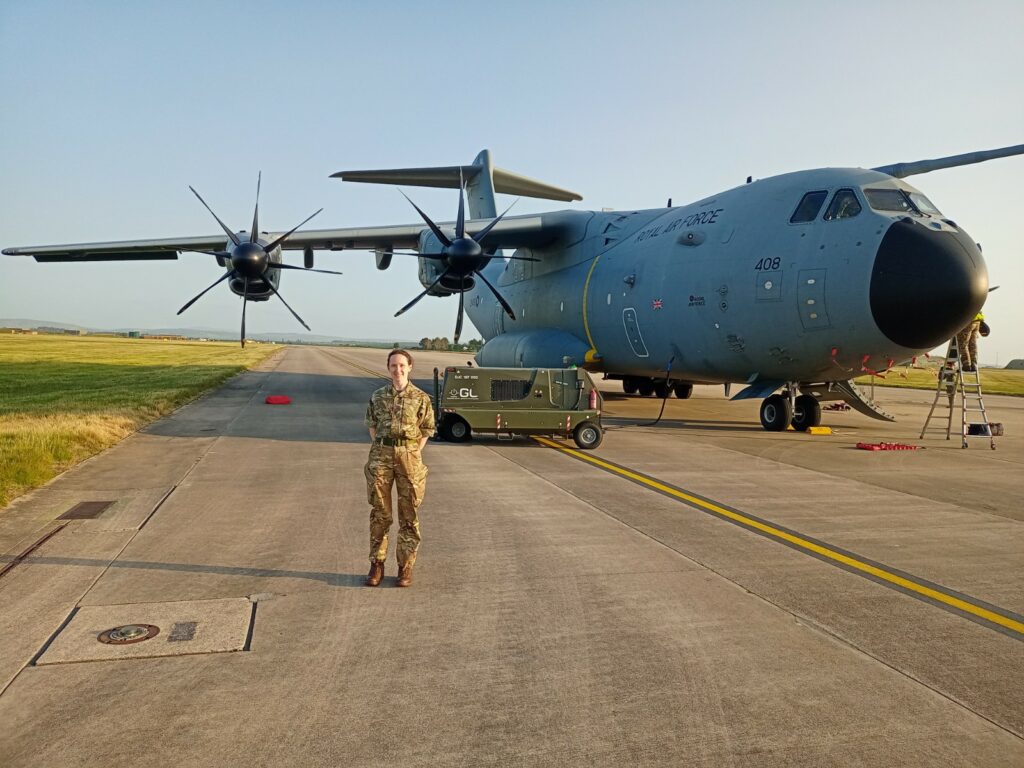 Reservist in front of an aircraft.
