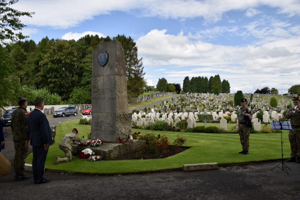 Cadet laying wreath at memorial