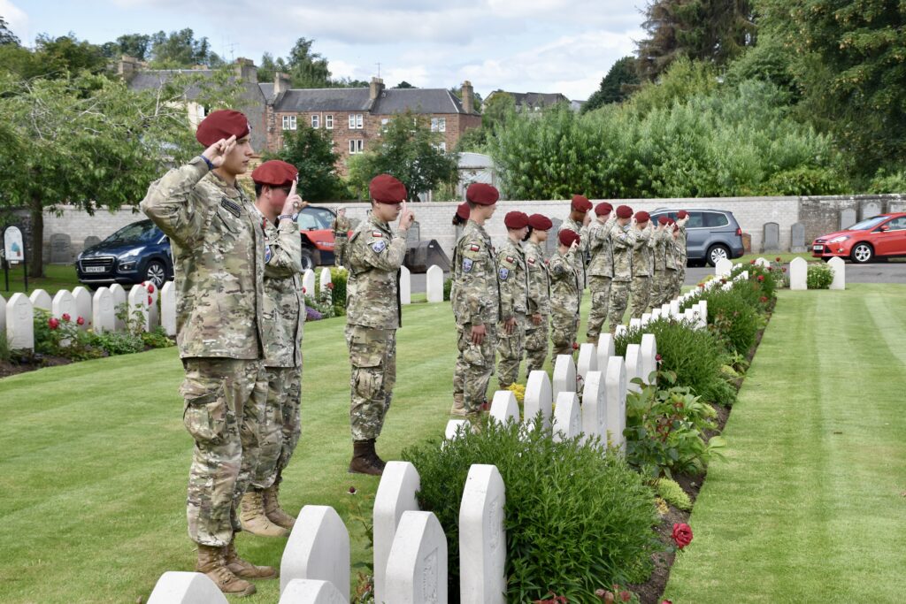 Seventeen Polish cadets in front of war graves