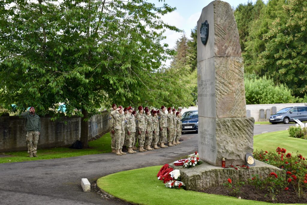 Polish Adult Volunteer and group off cadets with some saluting