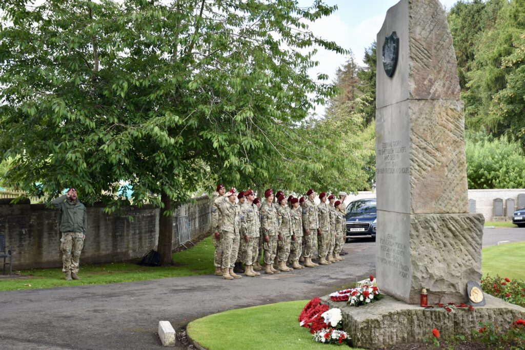Polish Adult Volunteer and group off cadets with some saluting
