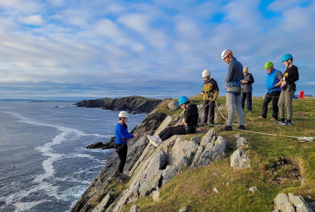 Cadets abseiling and rock climbing.