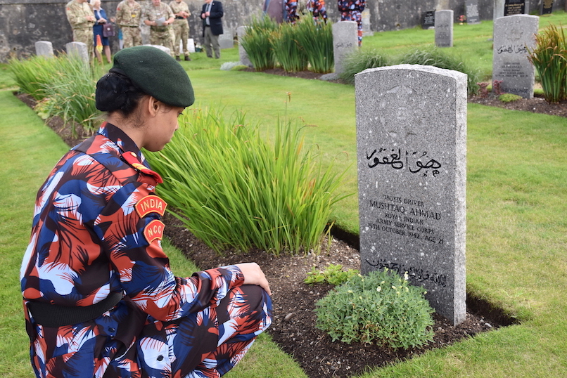 A cadet at one of the graves to the Force K6 men.