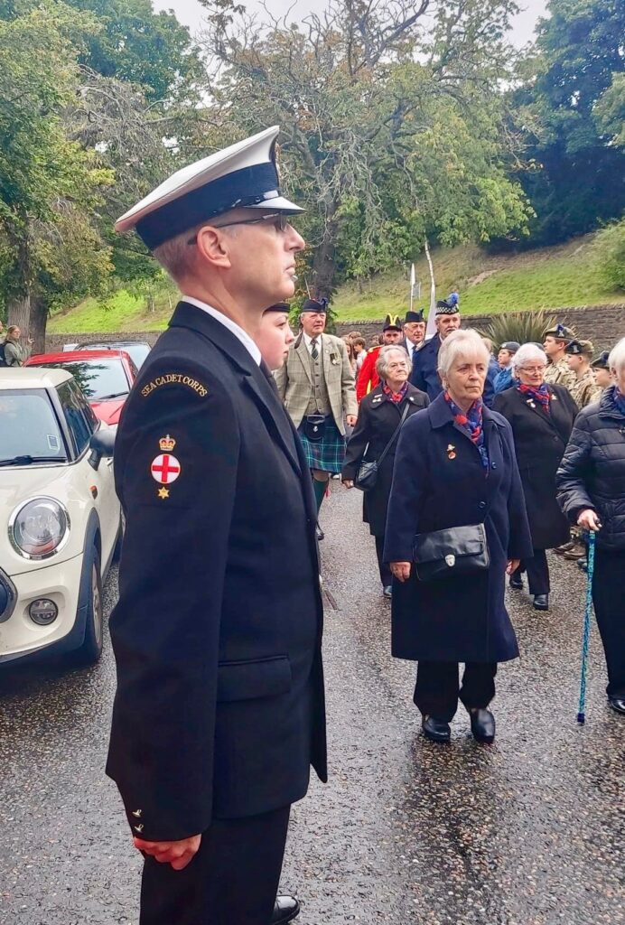 Members of the community arrive for the church service.
