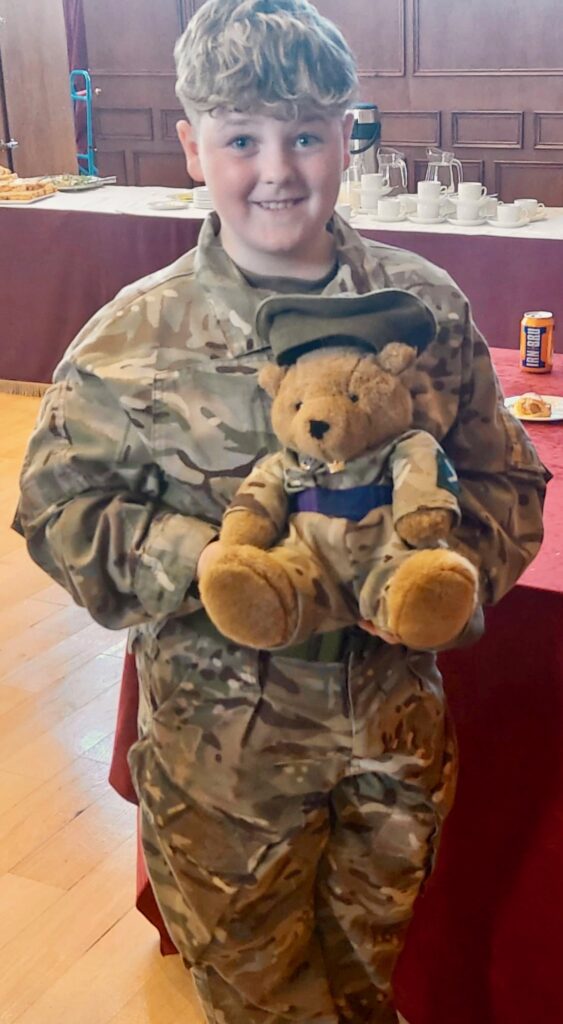 A cadet with HRFCA mascot Sgt Maj George Seathwood.