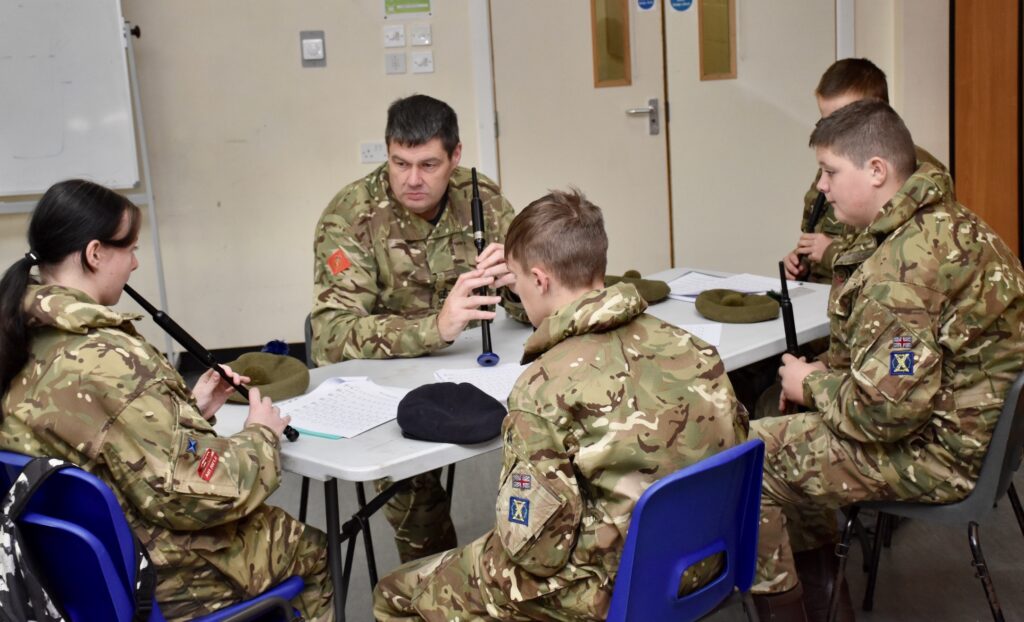 Practising under the watchful eye of an instructor.