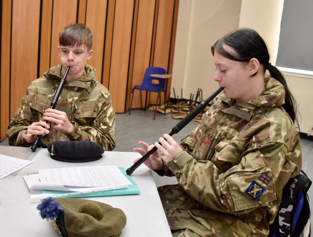 Cadets concentrate during chanter practice.