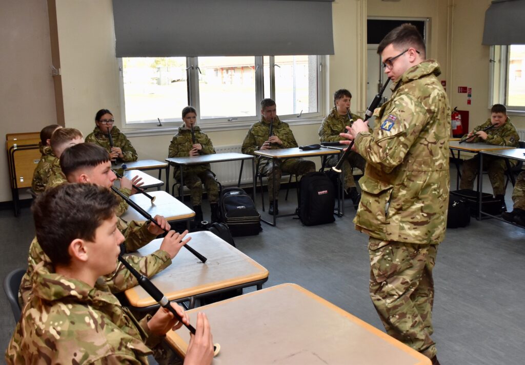 Cadets and an instructor practising with their chanters.