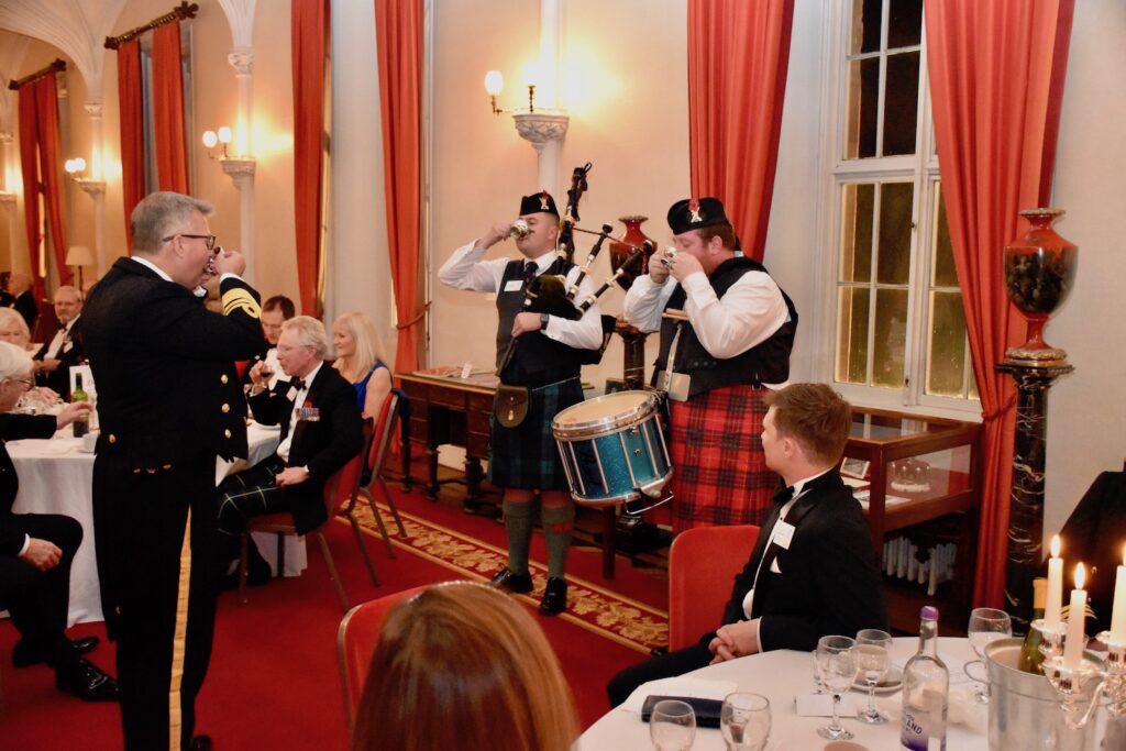 Chief of Defence People toasts the drummer and piper.