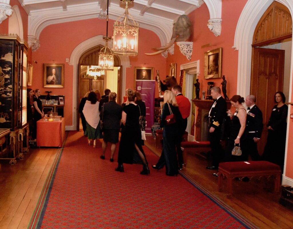 Guests heading into dinner in the Long Gallery.