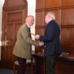 The Deputy Chief Executive and Chief Executive shake hands.