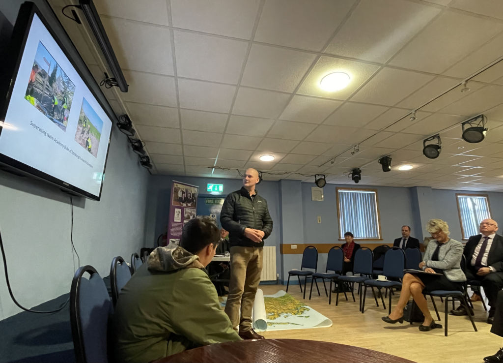 Former Army Cadet and parent of two former Army Cadets during his presentation with one of his children