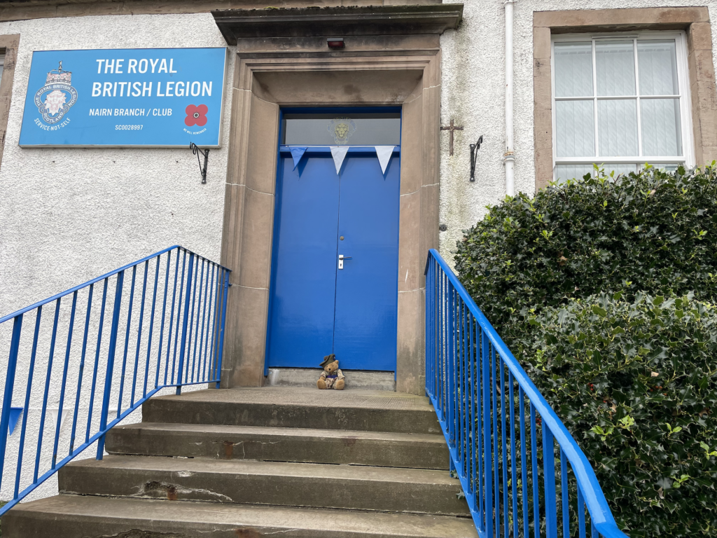 Highland RFCA's teddy bear mascot at The Royal British Legion building entrance