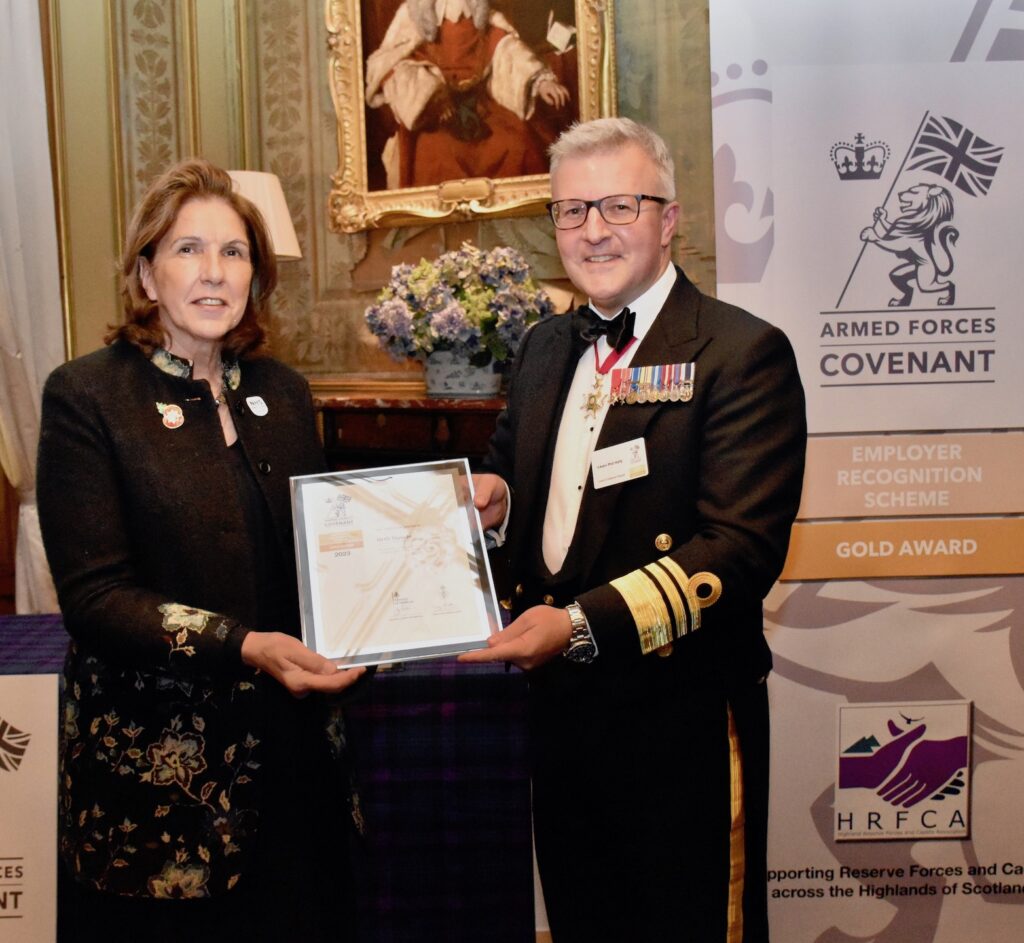 NHS Tayside Chair Lorna Birse-Stewart receives the award from Vice Admiral Hally.