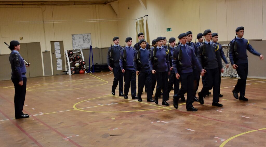 A group of cadets taking part in Arms Drill.