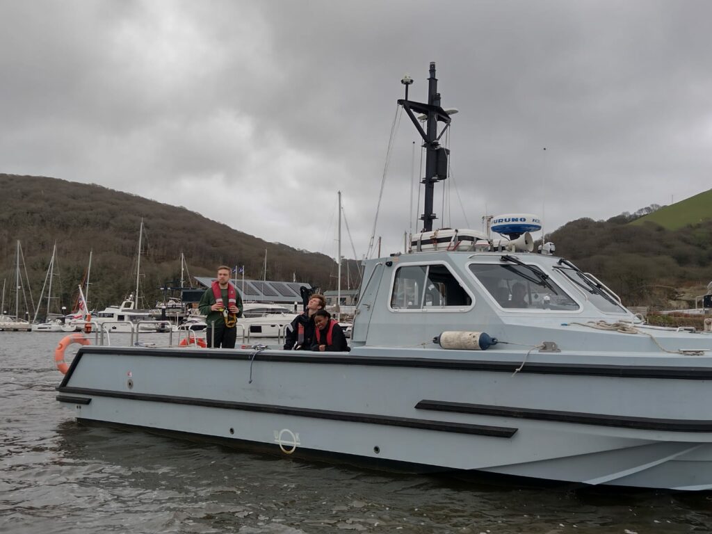 Officer Cadets onboard a small naval vessel.