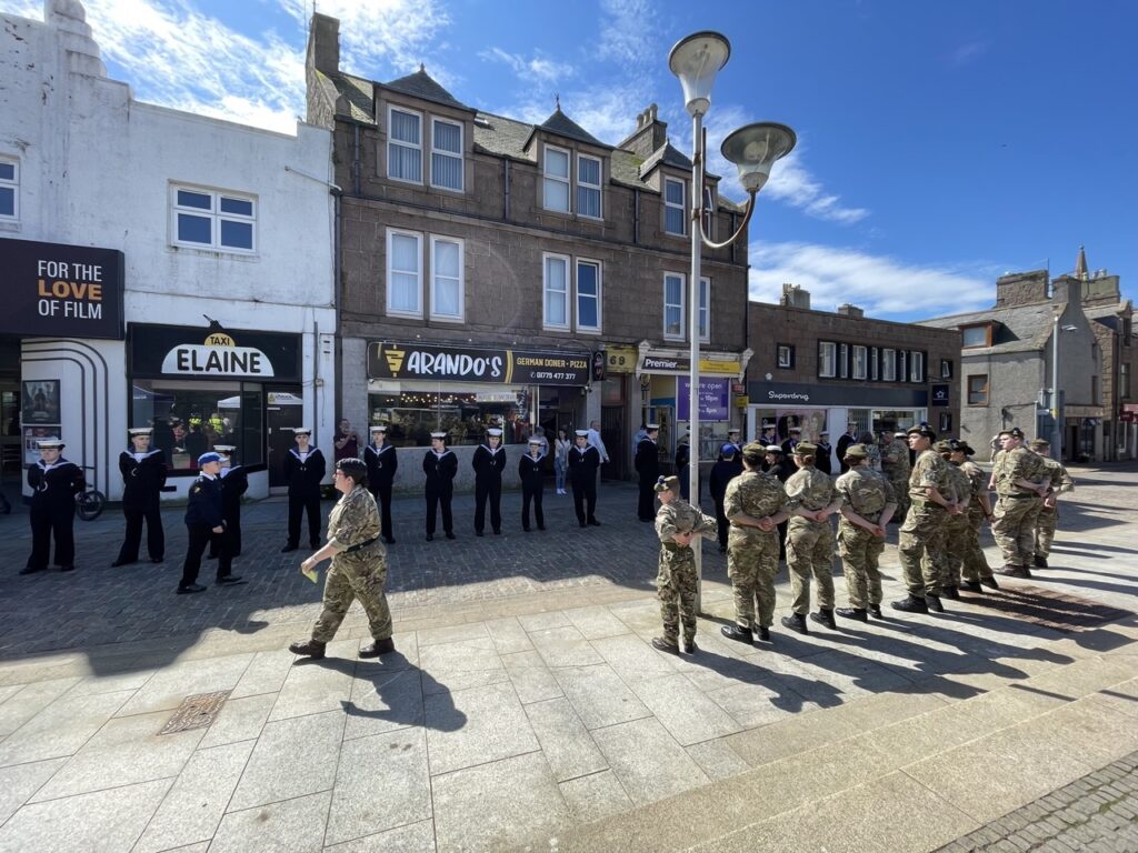 Rows of Sea Cadets and Army Cadets facing each other