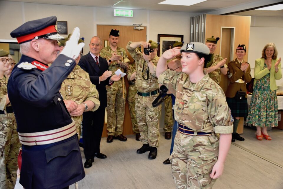 The Lord-Lieutenant promotes Cadet Sergeant Brown.