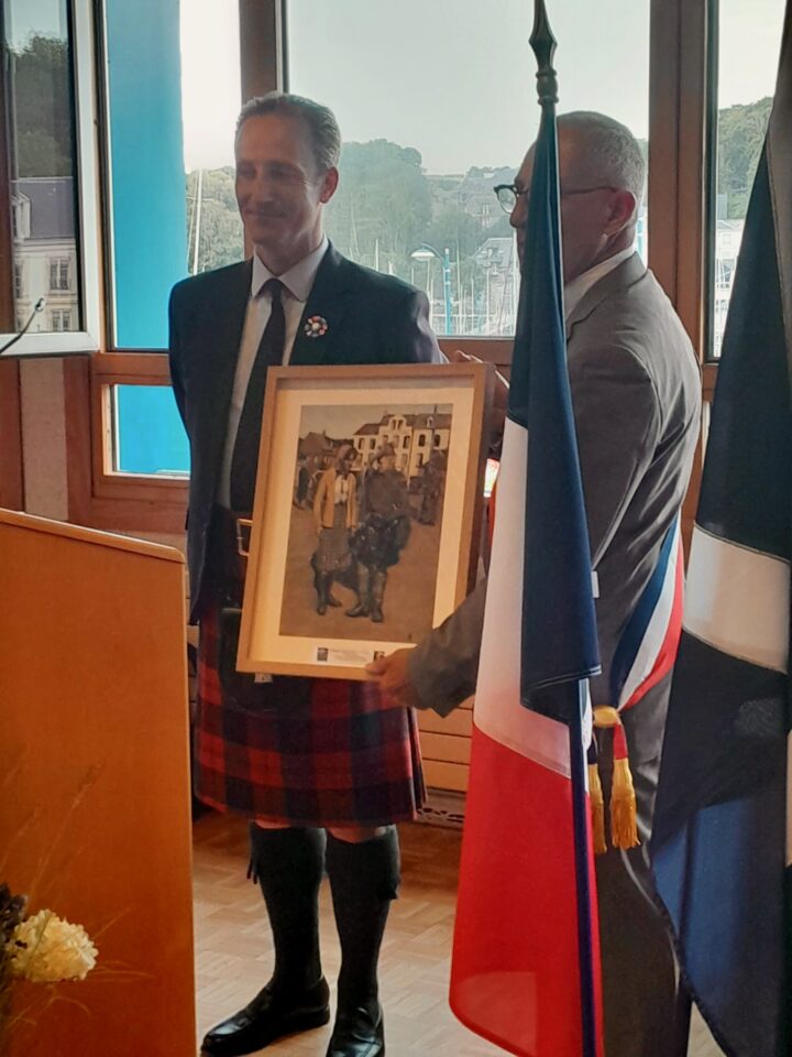 The Mayor of St Valery holds a painting presented to him by General Robin Lindsay.