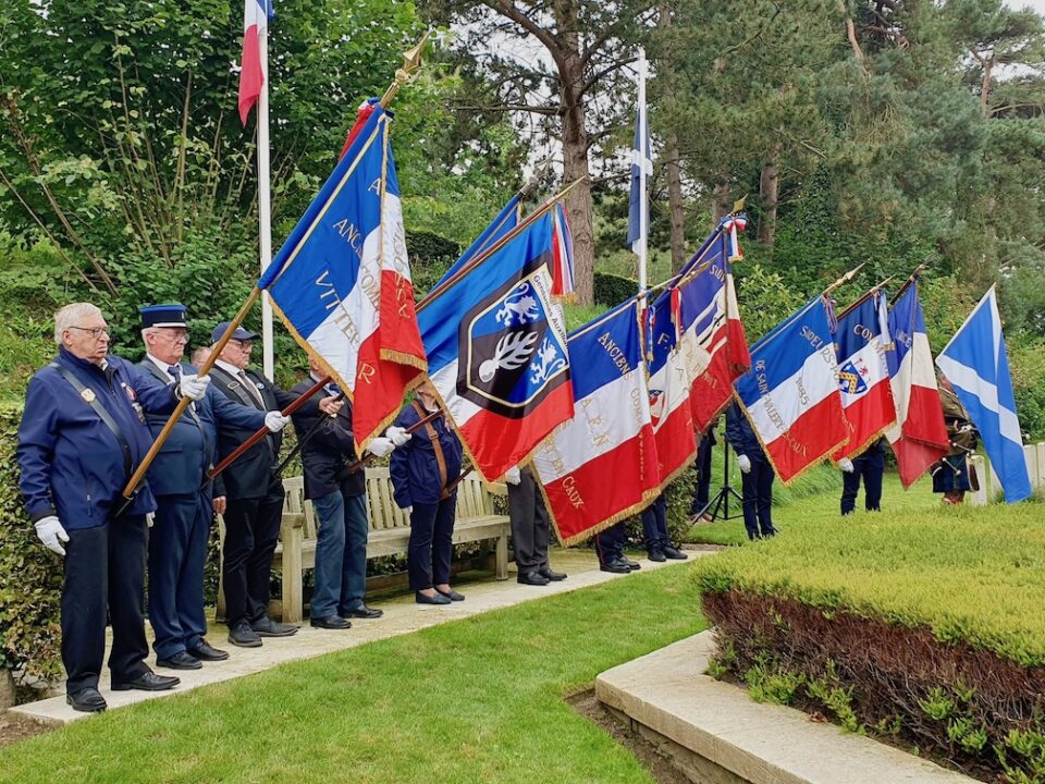 A row of flags at St Valery cemetery.