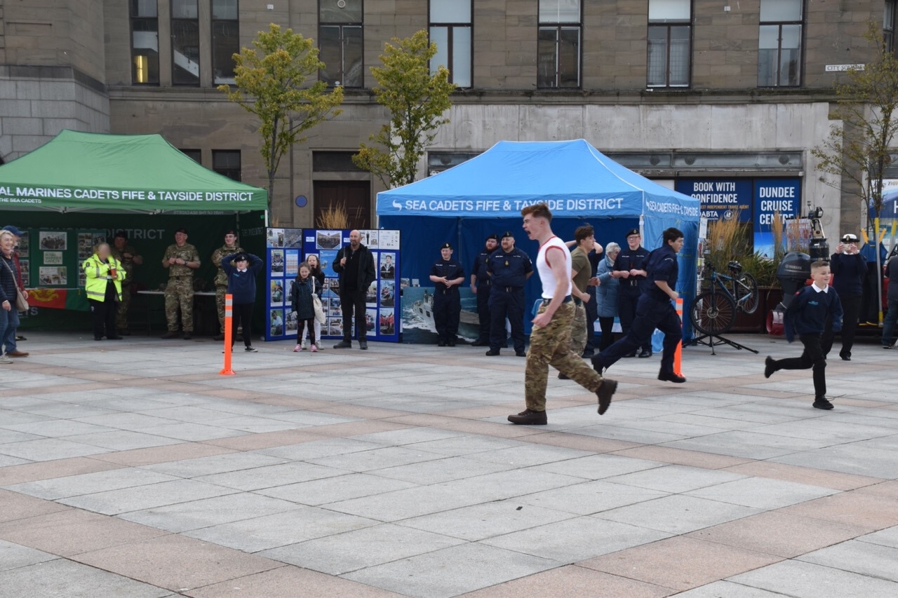 Cadets and Physical Training Instructor running.