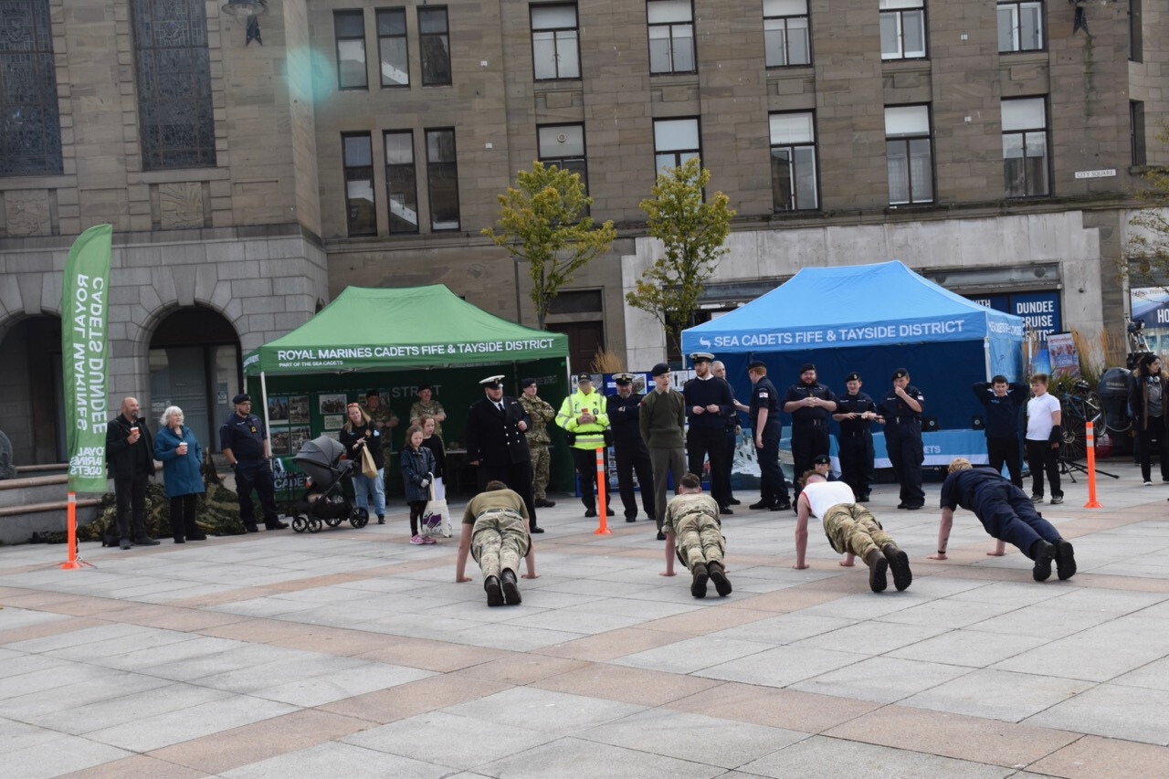 Cadets and Physical Training Instructor doing press-ups.