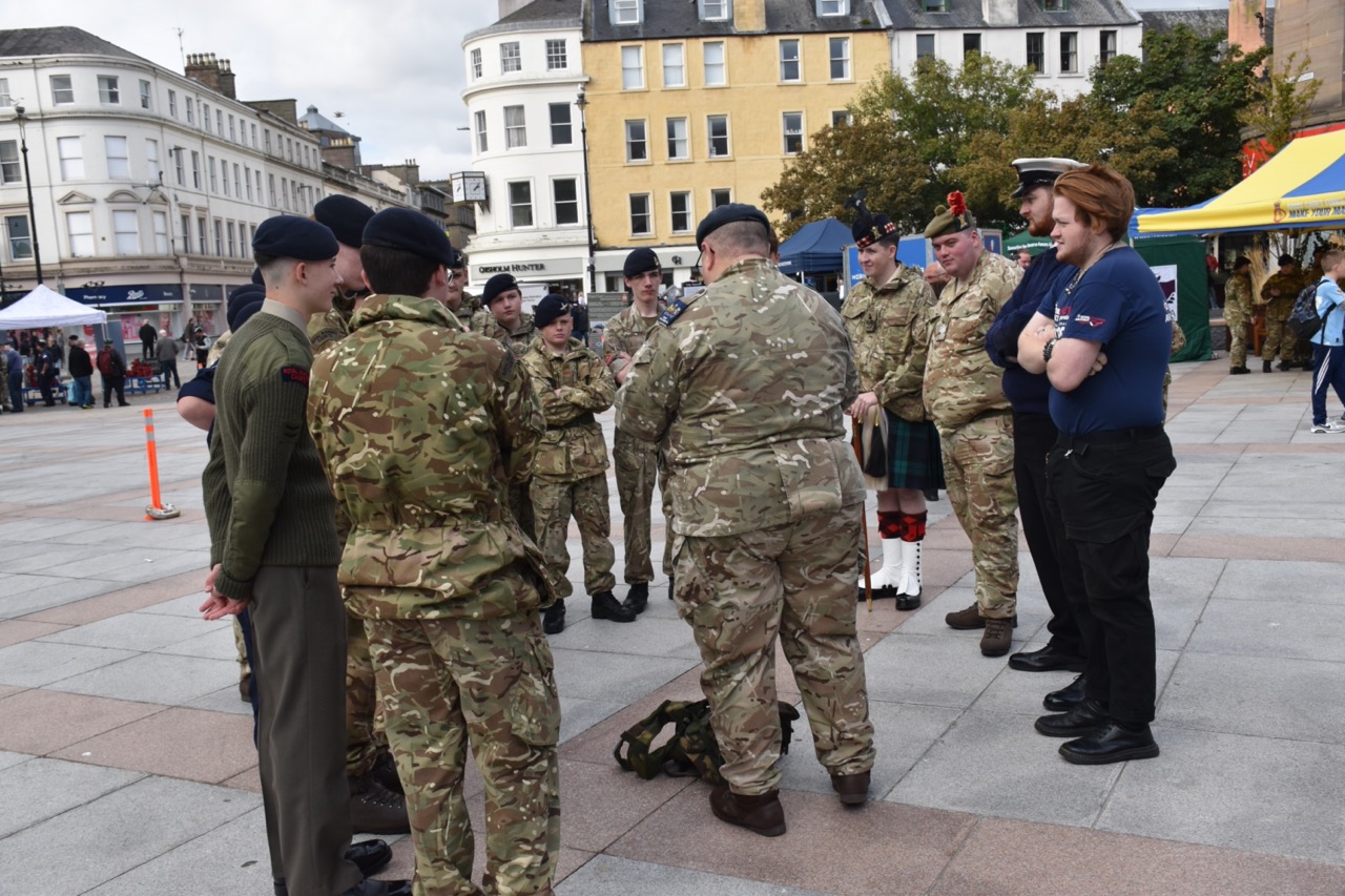 Cadets and Adult Volunteers huddled.